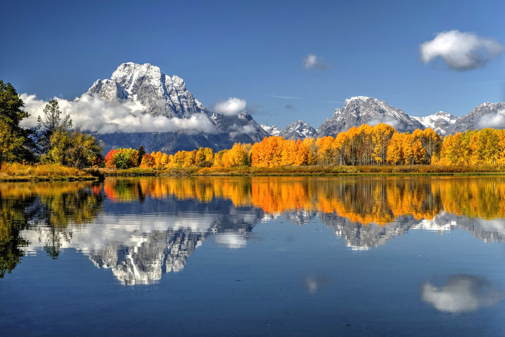 Autumn reflections along Oxbow Bend in Grand Teton National Park just after sunrise on a perfect September morning.